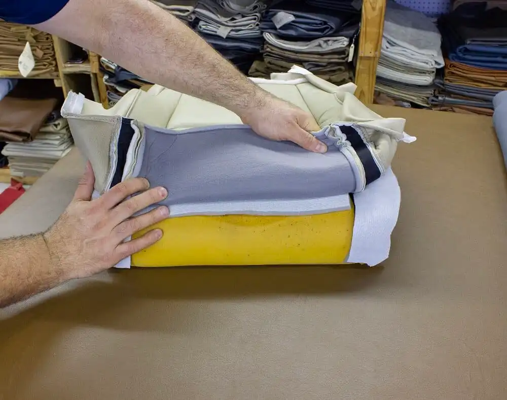 USF removing the seat cover from the foam cushion